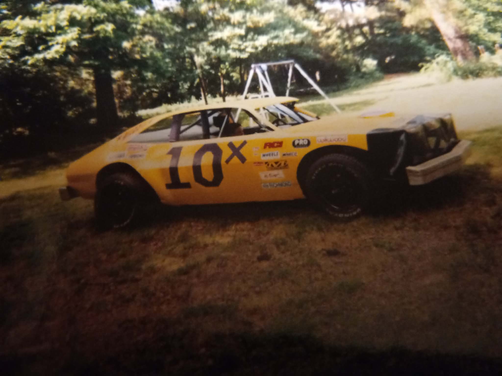 A faded print of Ronnie Rainey Sr.'s yellow 10X Mini Stock from the early 2000s