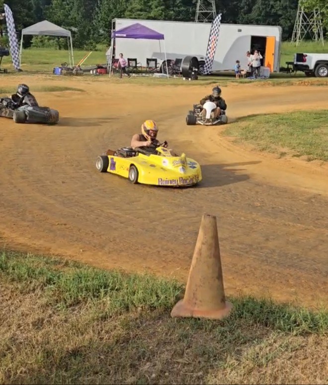 Travis in the yellow 10X running down two karts through the corner at Camden Speedway