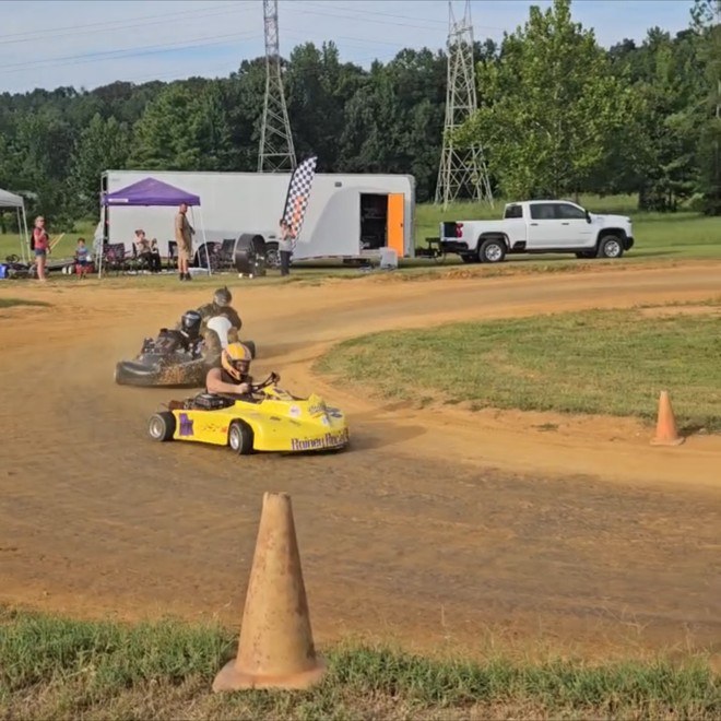 Travis chasing another kart into the corner in the Box Stock feature at Camden Speedway