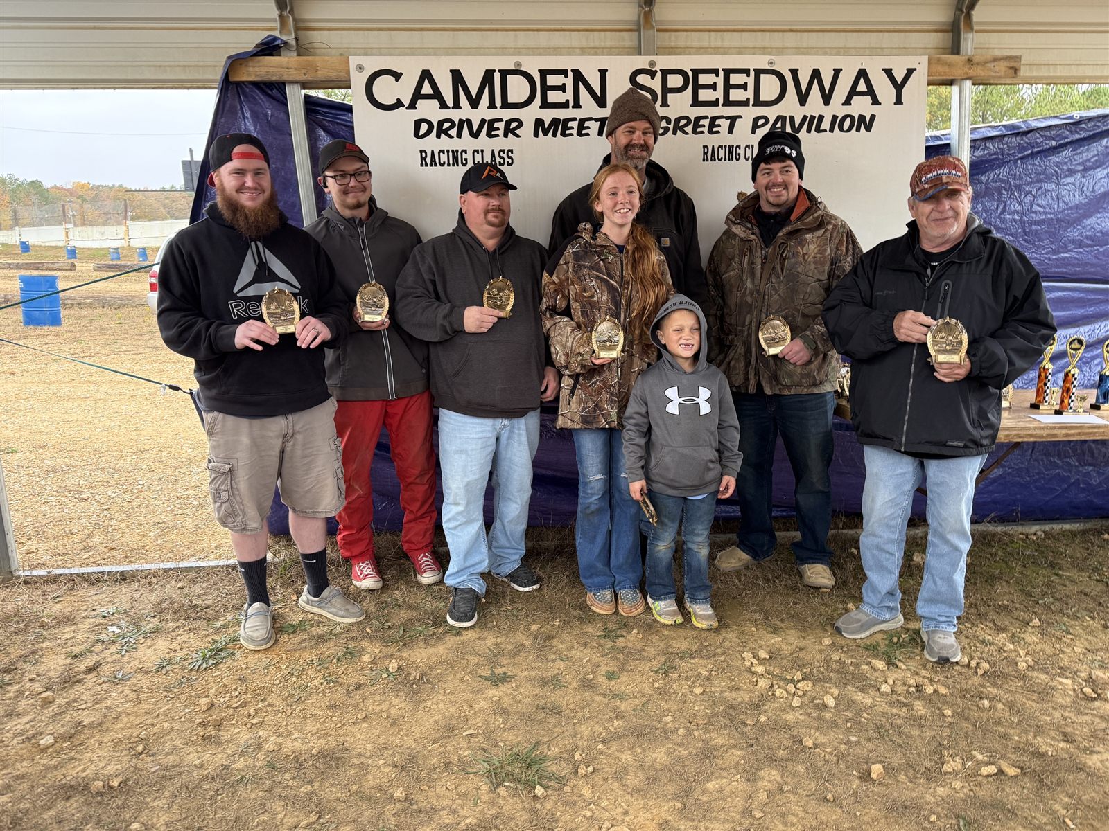 Drivers holding their awards at the Camden Speedway pavilion