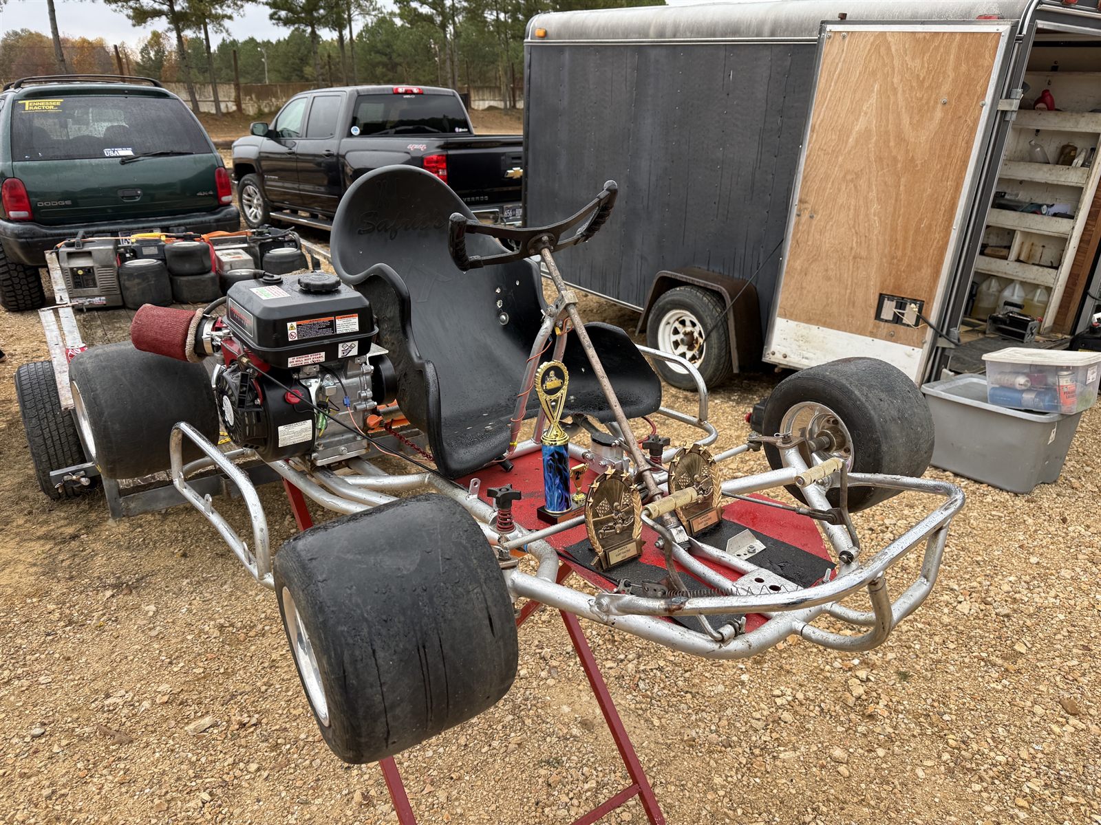 Race kart with 2025 trophies displayed on it