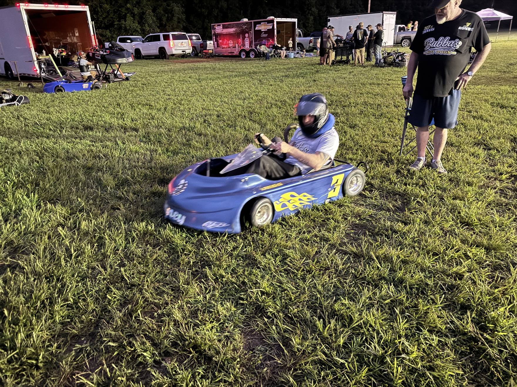 Ronnie fired up in the blue 3 kart in the pits at night at Sleepy Hollow Speedway