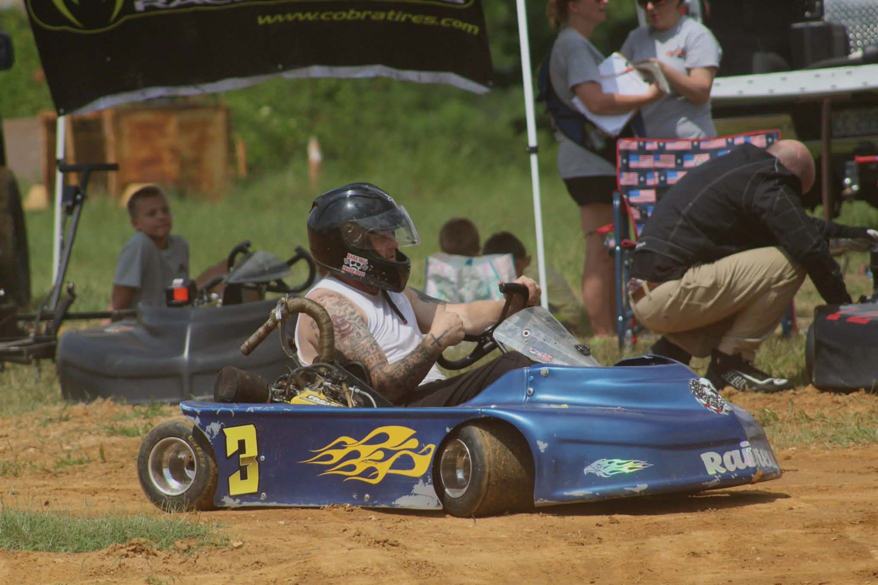 Ronnie sitting in the blue 3 kart in the pits at Camden Speedway